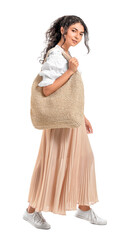 Beautiful young woman with eco bag on white background