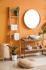 Stylish interior of modern bathroom with clean towels