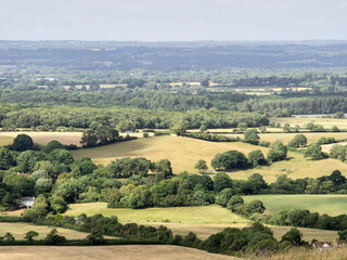 Fototapeta na wymiar tunning vibrant landscape image of English countryside on lovely Summer afternoon overlooking rolling hills and country villages