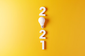 2021 creativity inspiration concepts, Light bulb idea with 2021 new year on yellow background, planning ideas.