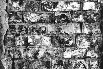 Close-up bright vintage brick wall background. Brick texture with scratches and cracks
