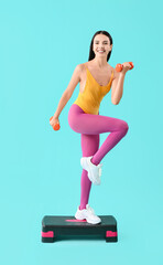 Young woman doing aerobics on color background