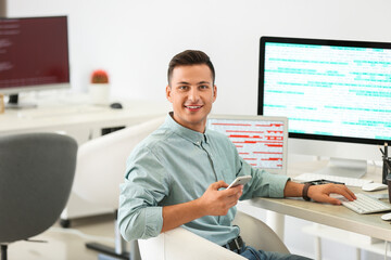 Portrait of male programmer in office