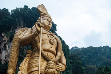 Fototapeta na wymiar Batu Caves statue and entrance near Kuala Lumpur, Malaysia.