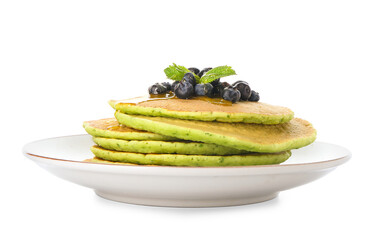 Plate with tasty green pancakes and berries on white background