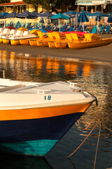 Sunrise. Early morning. Harbour with marine vessels, boats and lighthouse. Rethymno, Crete, Greece