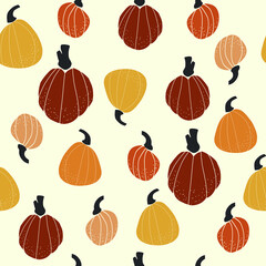 Seamless vector pattern with the image of autumn leaves, pumkins, nuts stylized in a flat style, Cozy and cute. Trendy colors of the autumn are perfect for scrapbooking paper, textile, fabric, card