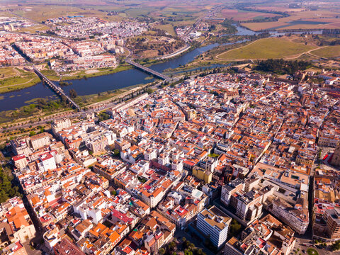 Aerial panoramic view of modern cityscape of Badajoz with Guadiana river, Spain