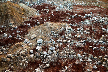 textures of various clay layers underground in  clay quarry after  geological study of  soil. colored layers of clay and stone in  section of  earth, different rock formations and soil layers.