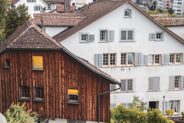 Fototapeta na wymiar Facades of old houses. wooden house with a tile roof