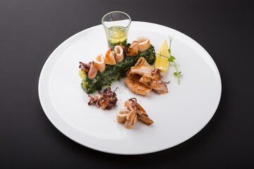 Fried seafood snacks with potato garnish