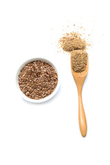Flax seeds. Flaxseed powder in a wooden spoon. Standing on a white background.
