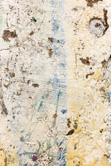 Fototapeta premium Background concrete wall, traces of weathering, worn wall damaged paint old paint. Remains of old paint on the painted concrete surface. Grungy concrete surface.