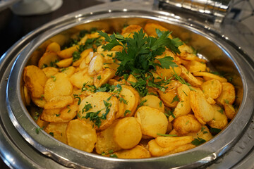 Close up salad bowl of baked potatoes