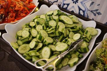 Close up salad bowl of sliced fresh cucumber