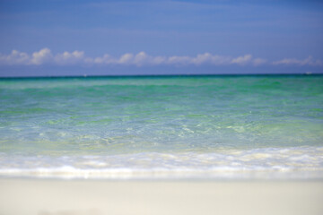 Sea beach with blue sky sand sun. Travel summer holiday background concept.