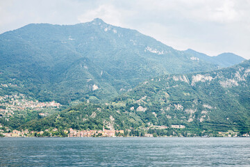 Fototapeta na wymiar Como Lake Panoramic Landscape. Mountains with Trees.