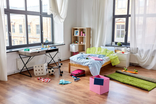 mess, disorder and interior concept - view of messy home kid's room with scattered stuff