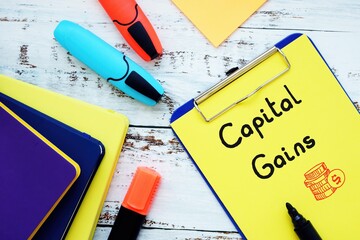 Business concept about Capital Gains with inscription on the sheet.