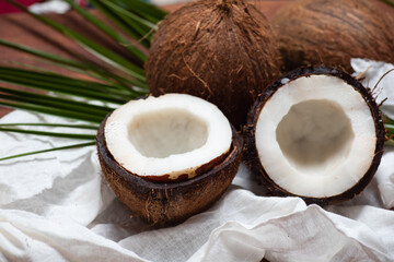 Open coconut on a wooden table top view