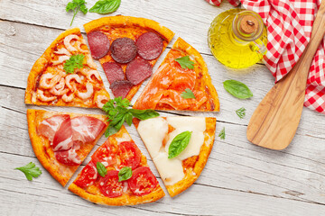 Tasty slices of different pizza