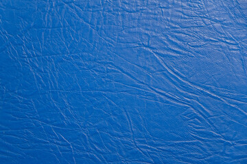 Fototapeta na wymiar Texture of blue leather surface, fabric for sewing furniture and other products.