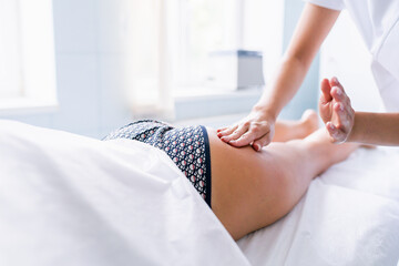 Legs and buttocks massage to reduce cellulite and phlebeurysm and preserve an healthy look. Skin and bodycare. Recovery.