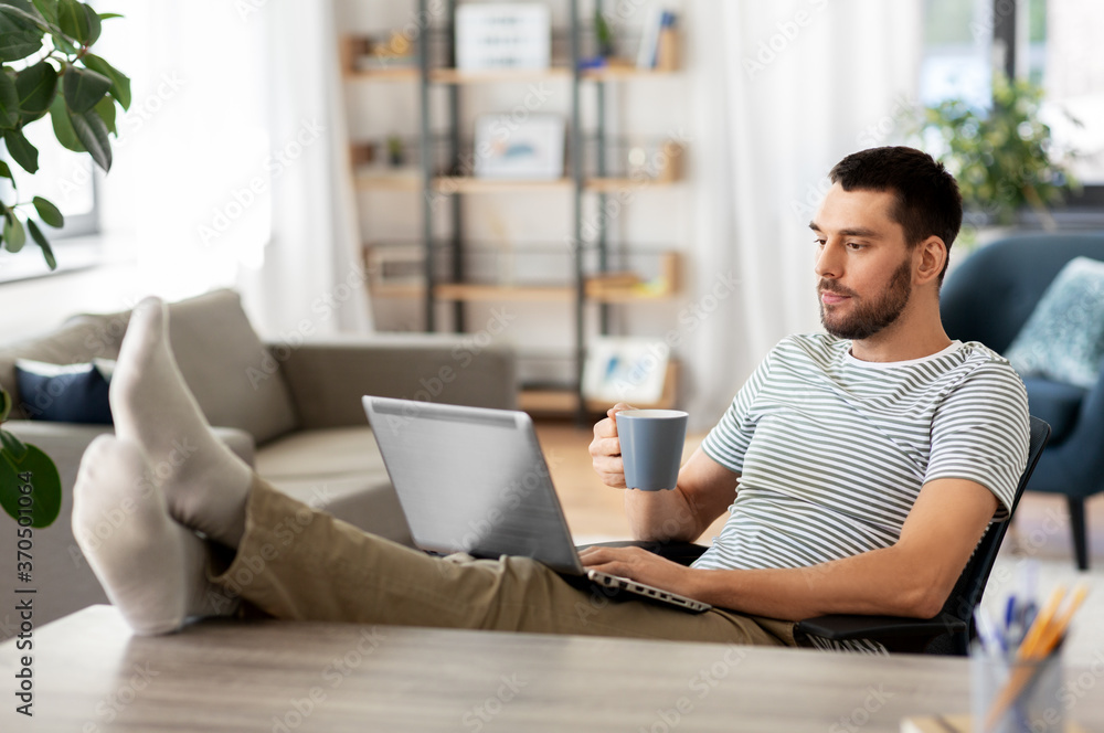 Canvas Prints technology, remote job and lifestyle concept - man with laptop computer drinking coffee and resting 