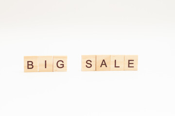 Word BIG SALE made of wooden blocks on white background