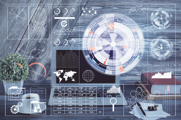 Double exposure of desktop computer and technology theme hologram. Concept of software development.