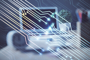Double exposure of desktop computer and technology theme hologram. Concept of software development.