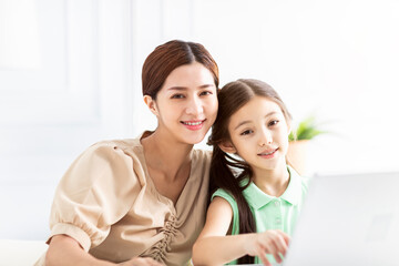 happy Mother  and her daughter at home