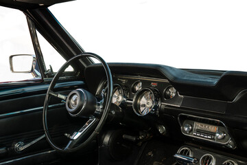 cockpit and steering wheel of a retro sports car