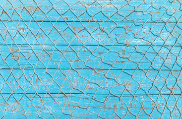 Fishing net over rustic blue wood, nautical maritime background - 370506252