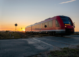 Obraz premium railcar crossing a dangerous, unguarded road crossing