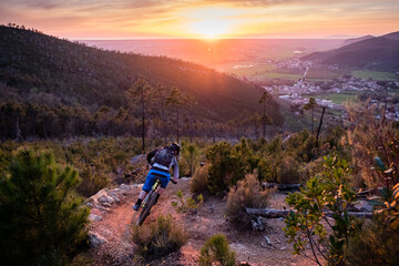 Fototapeta premium Mountain biker at sunset in Tuscany