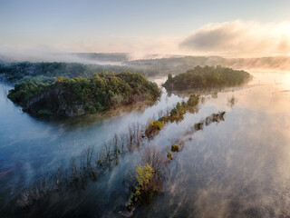 Morning fog over lake.