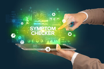 Close-up of a touchscreen with SYMPTOM CHECKER inscription, medical concept