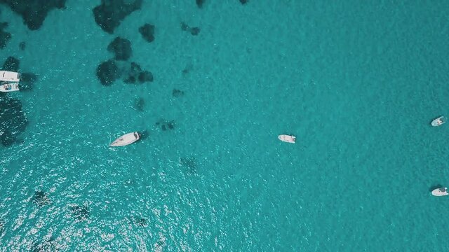 aerial view of sardinia shoreline ( mari pintau ) torquise sea water with clear blue sky in a sunny day during summer season.