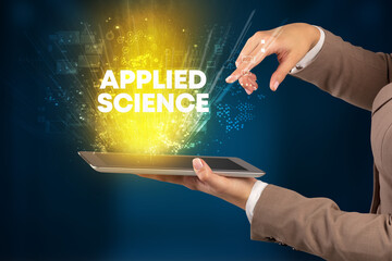 Close-up of a touchscreen with APPLIED SCIENCE inscription, innovative technology concept