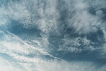 Blue sky with clouds, retro toning, natural abstract background texture