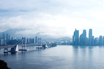 Fototapeta premium The beautiful beach and bay with thick mist blow from the sea to the land.