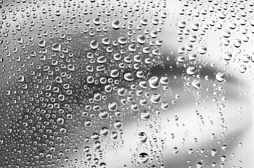 Water drops on glass surface. Droplets texture background