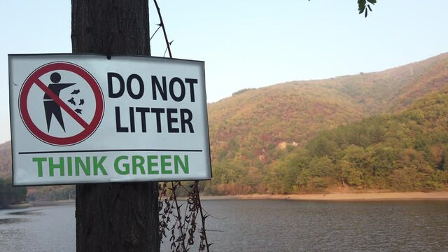 Do Not Litter Sign on mountain lake