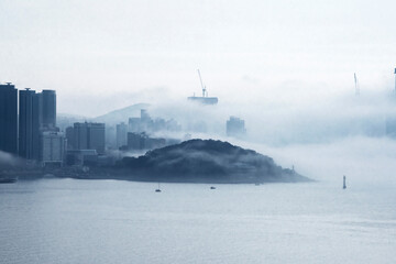 The beautiful beach and bay with thick mist blow from the sea to the land. © Chongbum Thomas Park