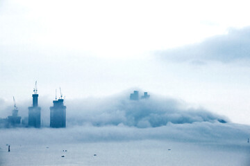 The beautiful beach and bay with thick mist blow from the sea to the land.