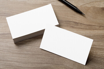 Minimal business card mockup on wooden desk