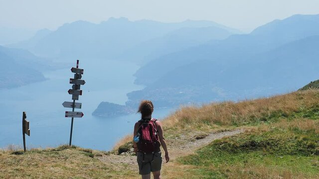 Trekking scene on Lake Como alps (the arrows indicates the names of the locations reached by the trails)