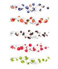 Set of different sliced berries with milk splashes on a white background