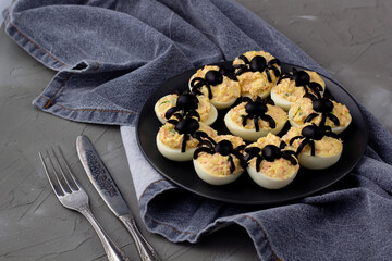 Deviled Eggs With A Spider For Halloween Party.